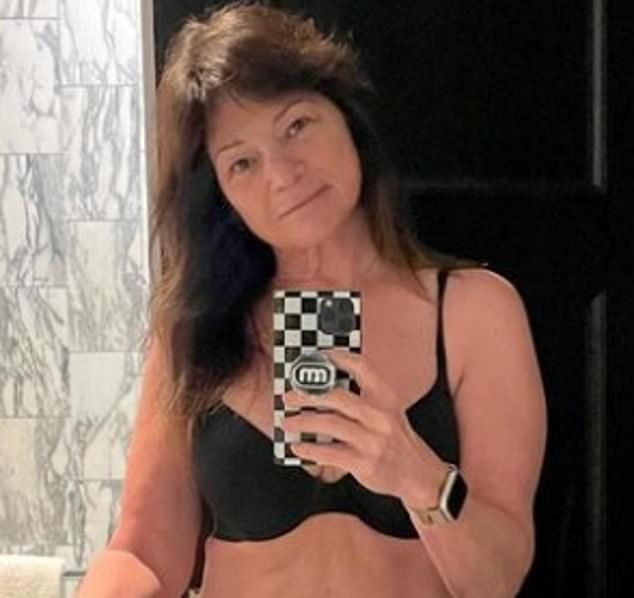 The Hot In Cleveland actress was in a black bra as she went makeup free with her dark hair down over her shoulders