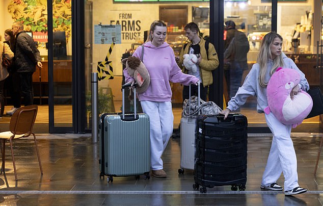 She wore soft, light grey sweatpants and an oversized pink hoodie as she was joined by a friend leaving the property