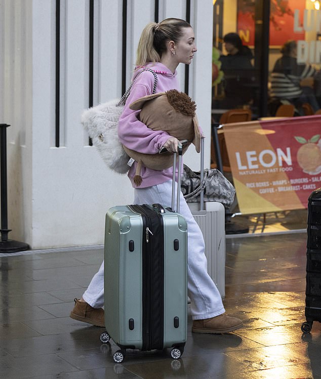 She walked past familiar hotspots and restaurants as she made her way to the waiting vehicle