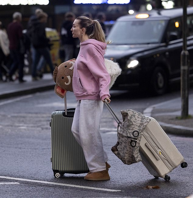 Dignified Kate could be seen hauling the beloved possessions across the road to the waiting car