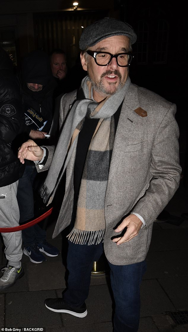 Producer Chris Columbus wore a wool blazer with a flat cap