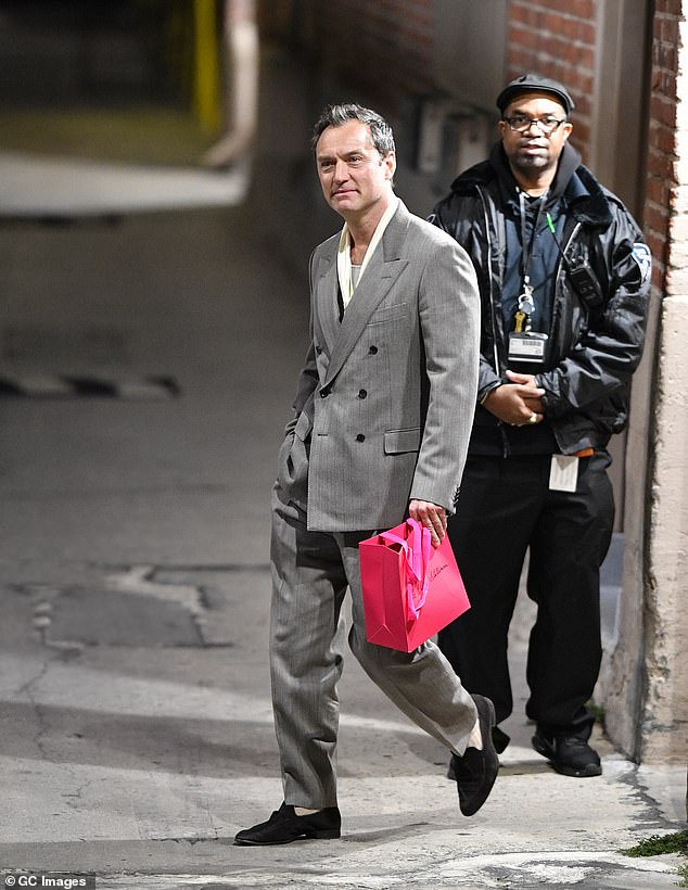 But the star looked worlds away from his most recent characters as he arrived at Jimmy Kimmel Live! in Hollywood in a suave baggy grey suit with dark grey loafers