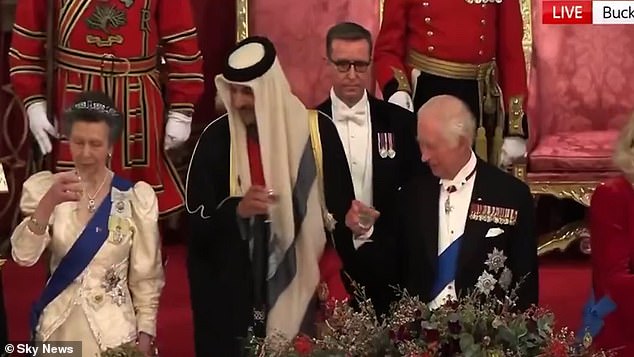 After a speech, those sat at the top table stood up to make a toast, but Anne suffered an awkward moment when she appeared to go and take a sip of her drink early