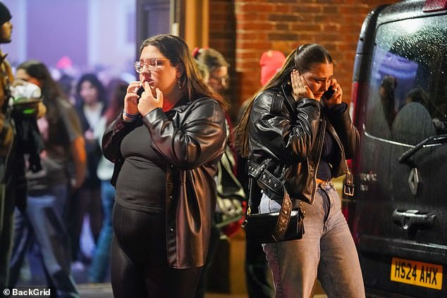 Fans were seen on their phones outside the venue after being told the show was canceled