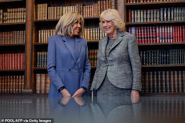 For the occasion, Queen Camilla cut an elegant figure in a mottled grey blazer and knee-length skirt