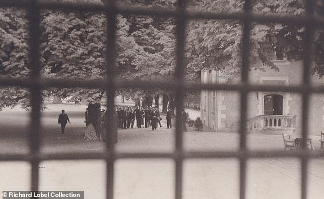 The small group of guests seen outside the chateau on Edward and Wallis's big day