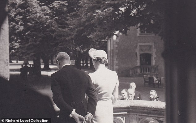 Edward and Wallis walking outside after tying the knot in an understated ceremony