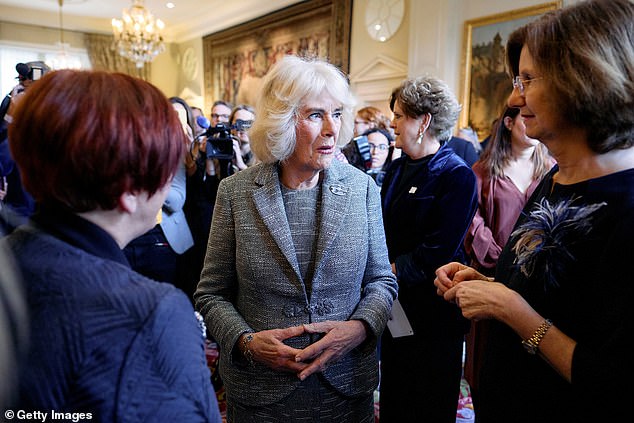 The Queen speaks with guests at the award ceremony