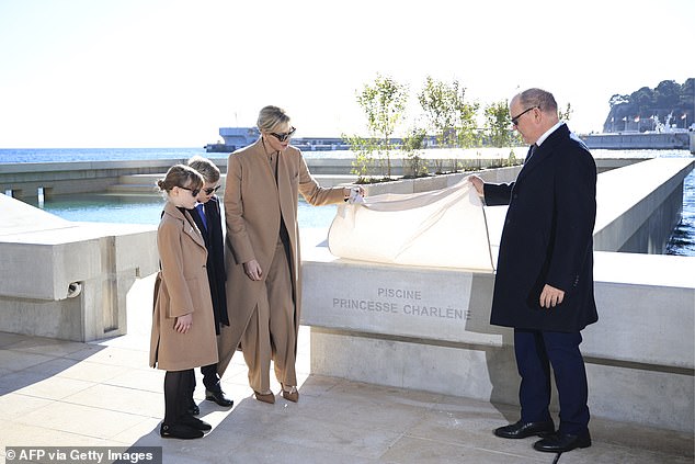 Princess Charlene with her twins, Prince Jacques and Princess Gabriella, and Monaco's ruler Prince Albert II. The family was inaugurating a new luxe residential development Mareterra and the complex's saltwater pool was named after Charlene - a one-time champion swimer