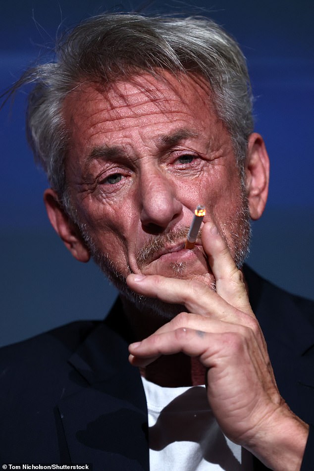 Sean Penn was pictured once again puffing on a cigarette as he spoke on stage at the 2024 Marrakech International Film Festival on Wednesday