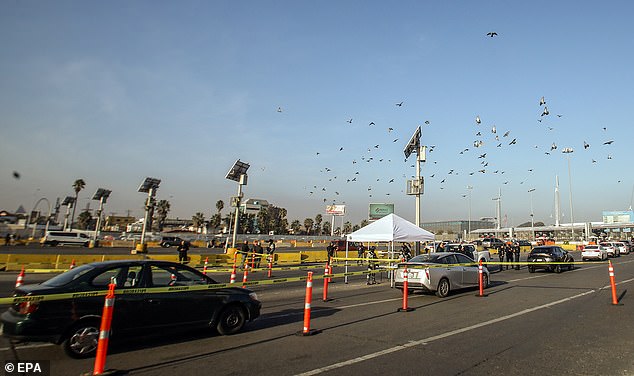 National Guard personnel conduct a vehicle inspection operation at the San Ysidro International Port in Tijuana, Mexico on November 28. The border city is considered one of the most dangerous in the world