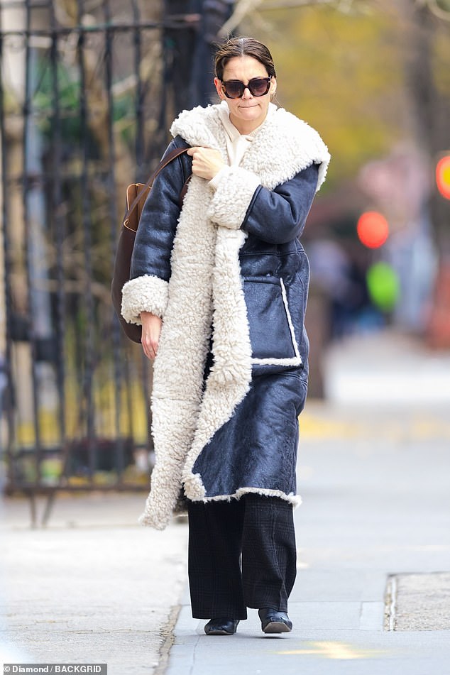 Katie Holmes was seen stepping out in New York City following her daughter Suri Cruise 's reported split from her high school sweetheart , Toby Cohen