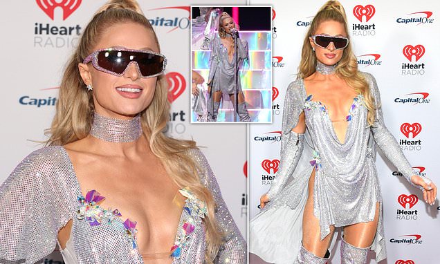 Paris Hilton sparkles in plunging metallic mini dress before hitting the stage at