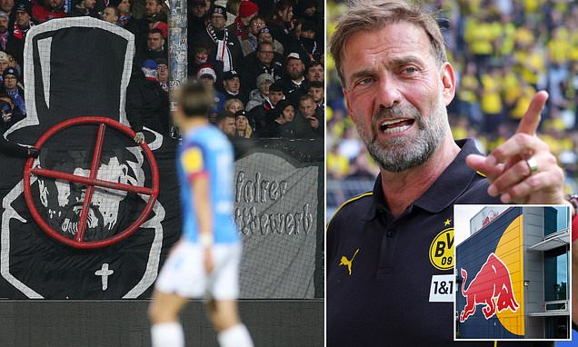 Jurgen Klopp is targeted by a threatening banner as protests rage on against the incoming