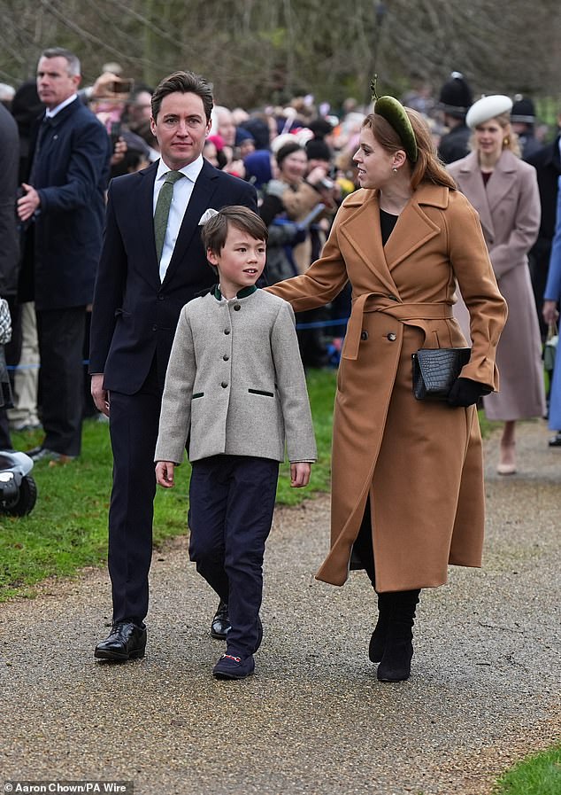 Beatrice, who fondly refers to Wolfie as her 'bonus child', placed a loving hand on the eight-year-old's back