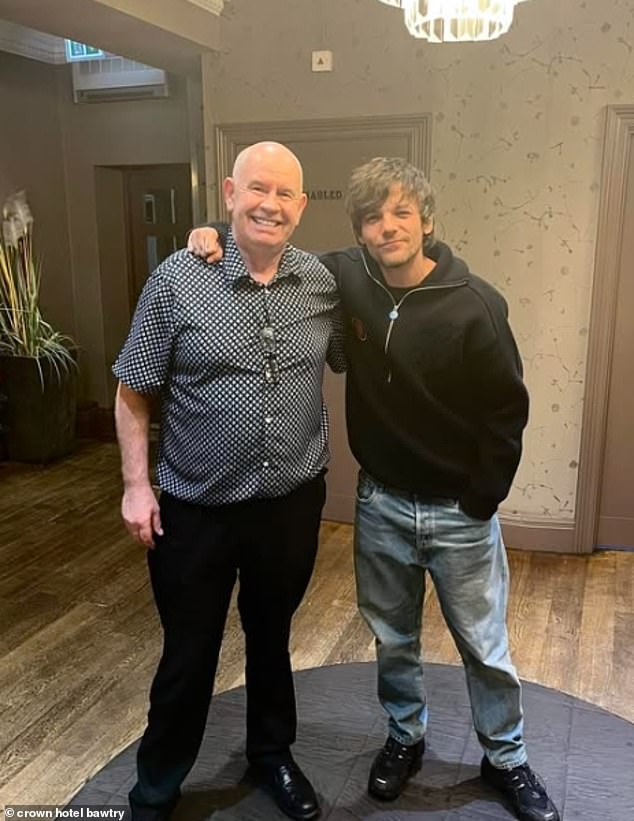 Louis Tomlinson was all smiles as he celebrated New Year's Eve at a local hotel in his hometown of Doncaster on Tuesday night