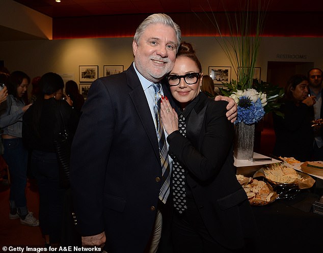 Mike Rinder, 69, passed a year-and-a-half removed from his advanced esophageal cancer diagnosis, and shortly after sharing a photo with his wife and two kids over Christmas. He is seen here with fellow Scientologist-turned-whistleblower Leah Remini in 2018