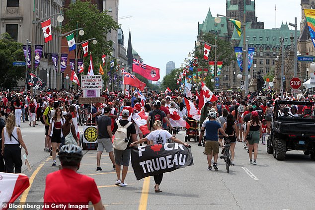 Protesters in Ottawa are seen airing their distaste for the liberal leader in 2022, with his popularity since plummeting further