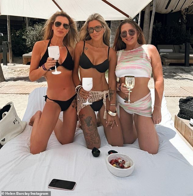 Helen (centre) poses with two friends for an undated Instagram picture during an overseas beach holiday