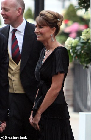 Carole wore the same earrings in 2011 for Kate and    Prince William's wedding party