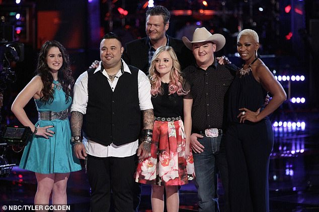 He is pictured second left with Shelton and fellow contestants on The Voice in 2014