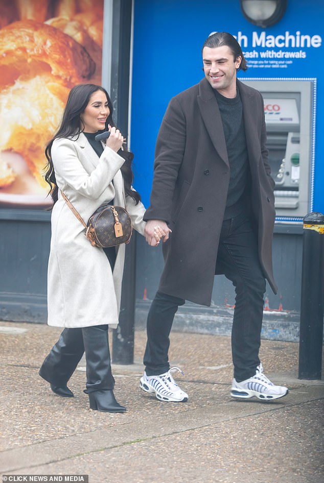 The on and off again couple were seen smiling as they left the Tesco supermarket today following the court hearing