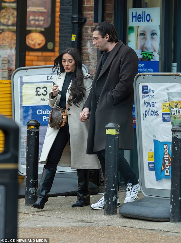 Ms Brockett, who is best known for her time on the hit reality TV show TOWIE wore a cream boyfriend coat coupled with an all-black ensemble and boots as well as a Louis Vuitton designer bag