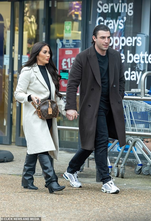 Reality TV star Jack Fincham walks free hand in hand with his loyal Towie girlfriend Chloe Brockett after appealing his six week jail sentence for a dog attack