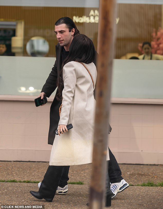 The TOWIE star appears to kiss her criminal boyfriend on the cheek as they walk the streets of Essex today