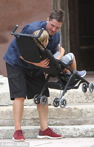 Doting dad: Christian carried his son and his pushchair into a water taxi