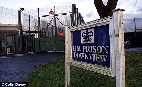 The three men have been suspended from their jobs at Downview prison in Sutton, Surrey