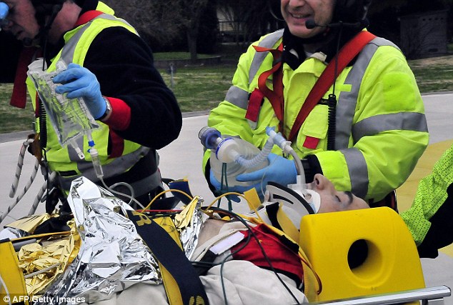 Taken to hospital: Service workers carry Robert Kubica following his serious accident in Italy