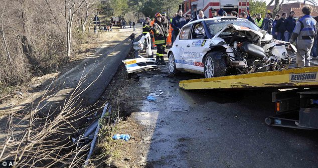 Wrecked: Kubica's car is towed away following the crash