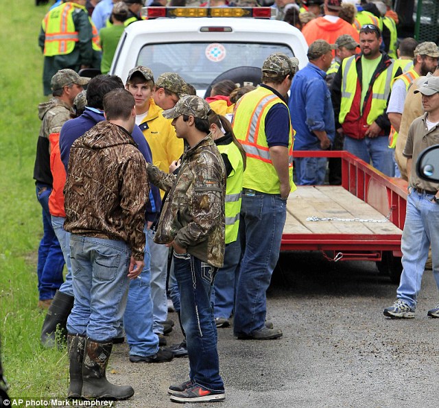 Help: Volunteers unloaded from trucks and trailers in April to begin searching along rural roads for evidence