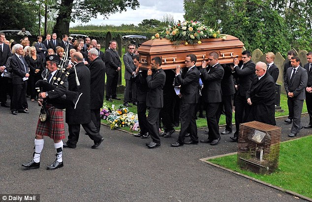 Final journey: Ian Redmond's fuenral procession at St Michael's Parish Church, in Dalton near Wigan, Lancashire