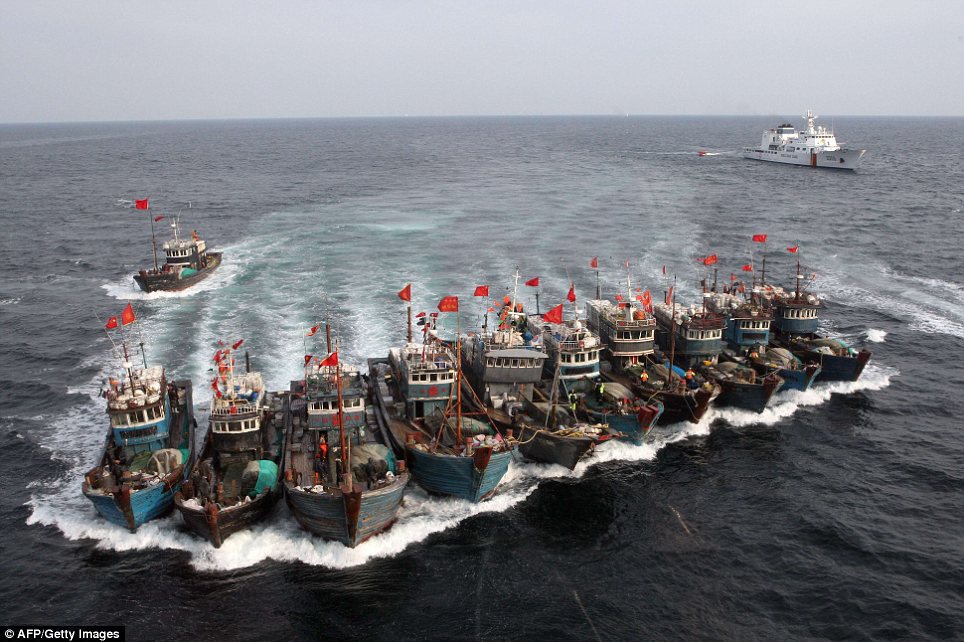 Running from the law: Chinese fishing boats tied themselves together to try and evade capture from South Korea's coastguard