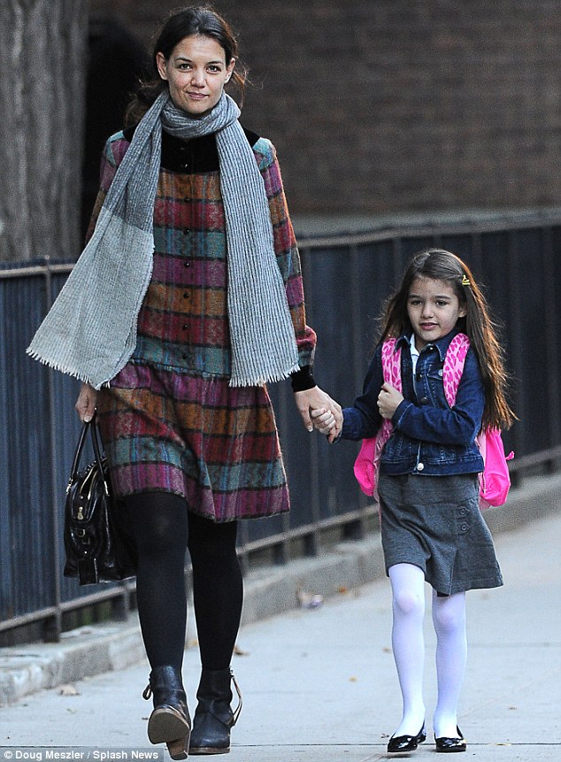 Model student: Katie and Suri head to school on Monday morning, Katie with her Nina Ricci La Rue handbag, Suri with her pink backpack