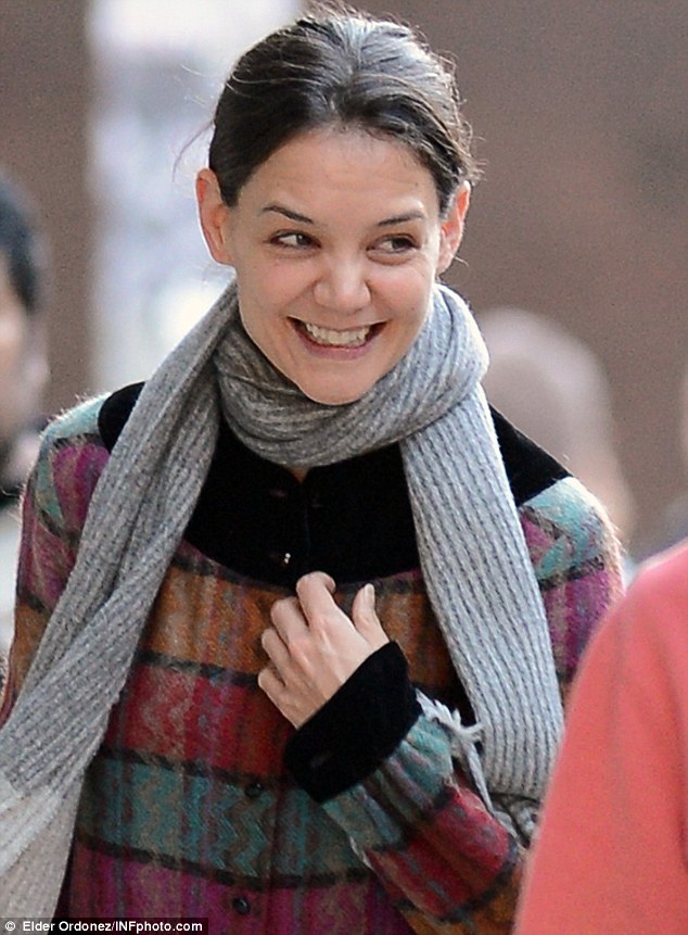 All-smiles: The 33-year-old was in extremely high spirits as she bantered with people on the street