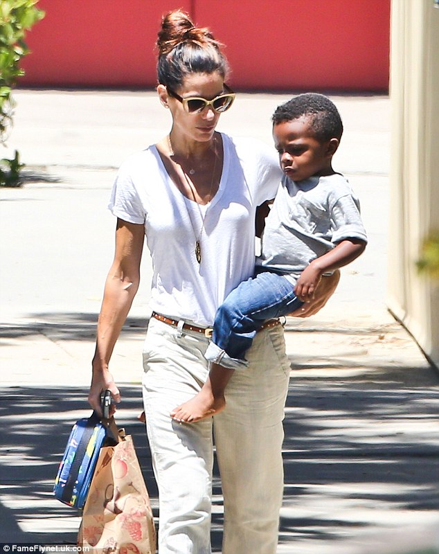 The love of her life: Sandra recently gushed about her adopted son Louis to German magazine Bild