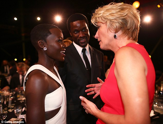 Wise words: Emma chats to Best Supporting Actress winner Lupita Nyong'o inside the event