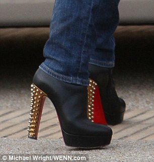 Well-heeled: The star's pricey boots were definitely made for walking