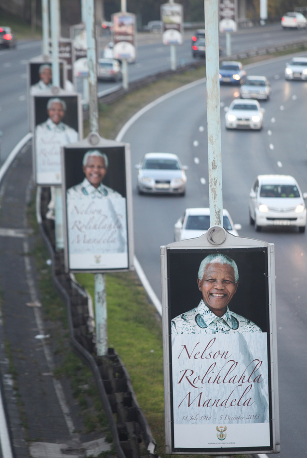 Posters depicting the late former president Nelson Mandela are lined up along a freeway in Johannesburg, Friday May 2, 2014. The country goes to the polls We...