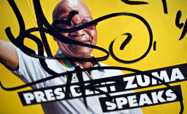 An election poster of incumbent President Jacob Zuma is defaced in the downtown area of Johannesburg, South Africa Friday, May 2, 2014. South African politic...