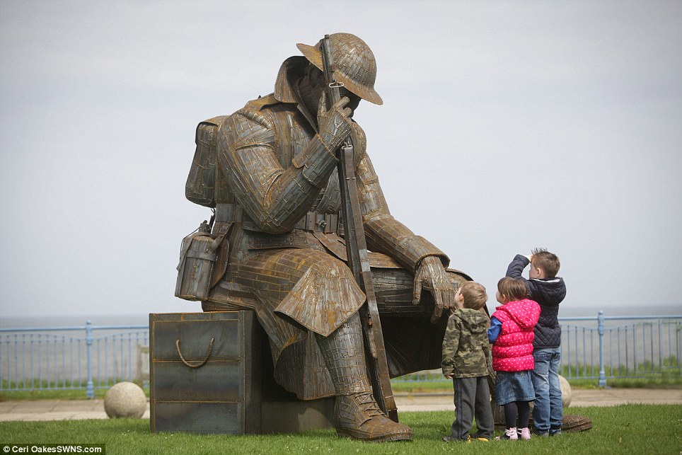 Tribute: This sculpture of a World War One soldier reflecting on the war just a minute after peace was declared will be in place for three months on Seaham seafront in County Durham