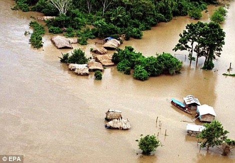 Strong El Niño events occur every 20 years or so. On the left, the village of Puerto Maldonado, Peru, is seen flooded in January 2003 as a result of El Niño rains, which drove 16,000 people from their homes. The worst El Niño on record in 1997 to 1998 was blamed for massive flooding along China's Yangtze river, right, that killed over 1,500 people