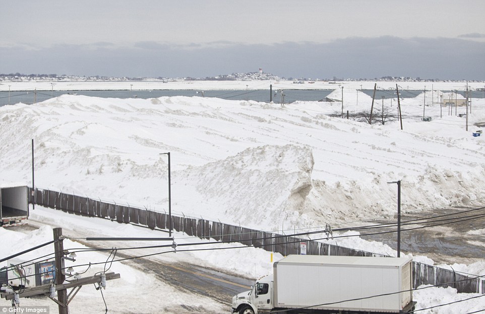 Snow piles up at a 'snow farm' on Tide St. in Boston, Massachussets. City workers are dumping tons of snow at the lot in an attempt to clear the streets. Boston has received over 70 inches of snowfall in the last 30 days