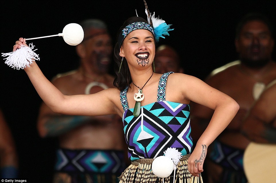 From Manawatu, members of the Te Tu Mataora team are clad in striking turquoise blue and purple costumes