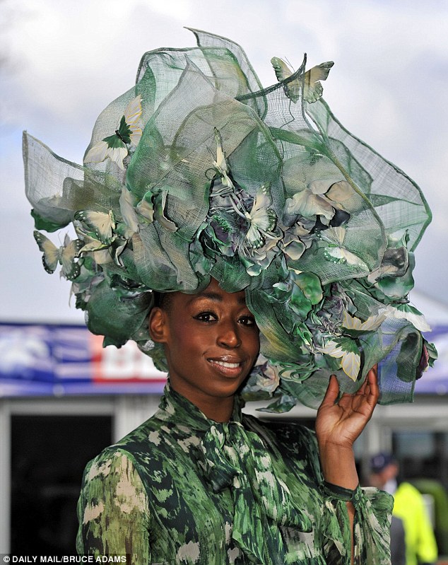 Alexis Althrope in an ornate butterfly hat at the Grand National race meeting at Aintree racecourse