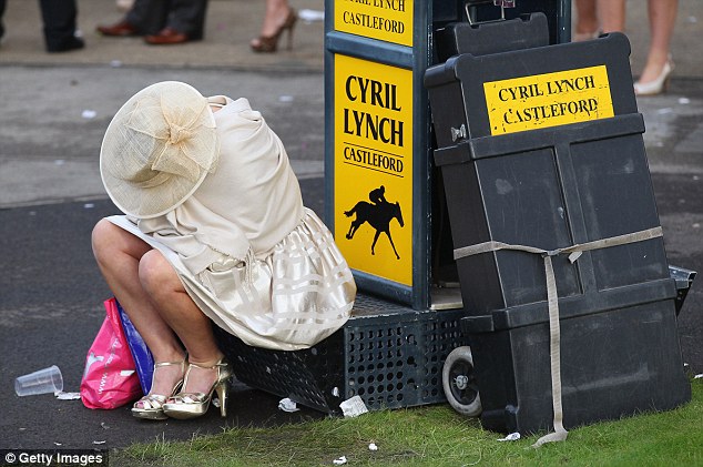 A racegoer looks worse for wear after Ladies' Day at Aintree Racecourse in April 2012