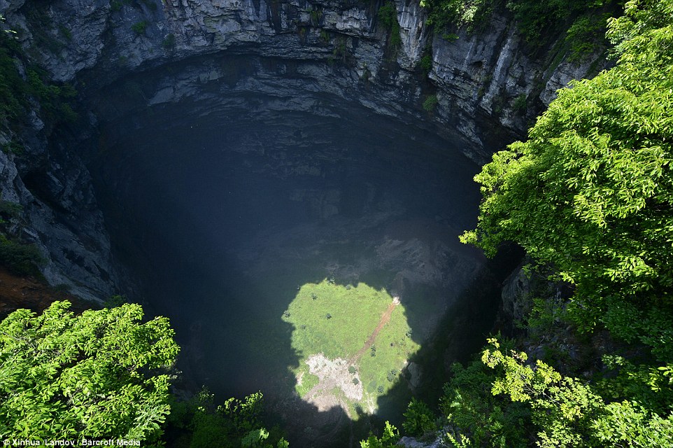 Big drop: No one has been inside for many years because the only way to get down is by abseiling down the side of the cave